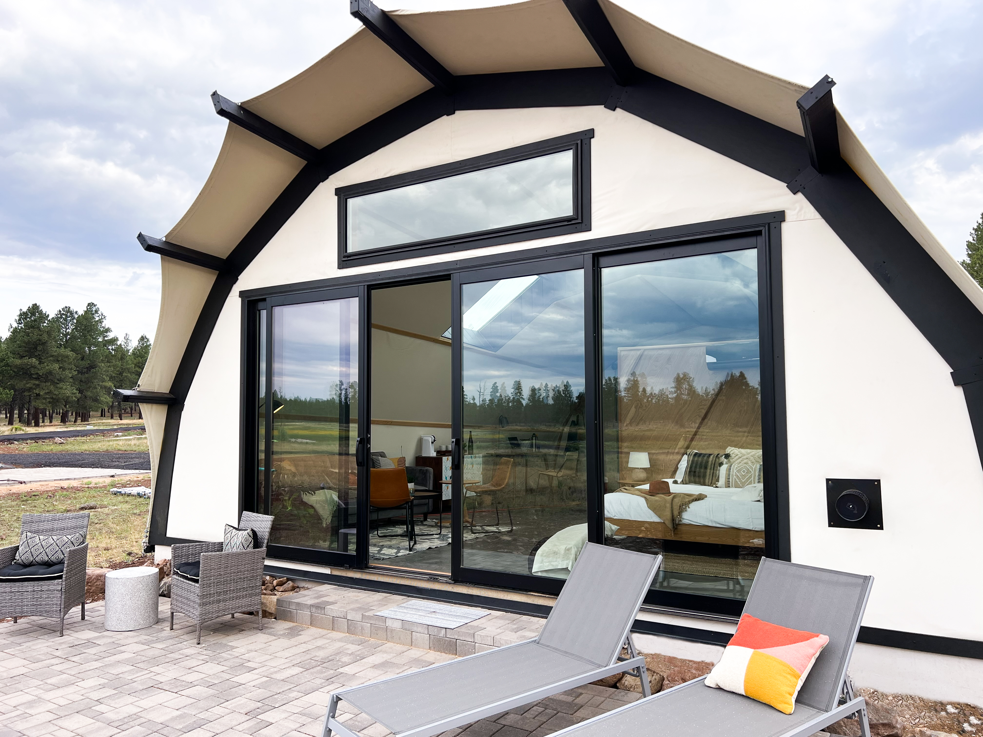 The exterior of a Backland luxury glamping tent.